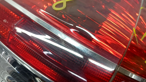 Light outer wing left Nissan Rogue 14-16 chip on glass, scuffed, crack