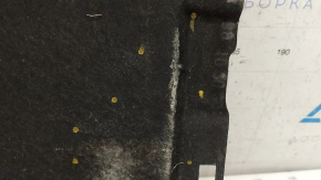 The rear left underbody protection of Audi A6 C7 12-18 is torn and worn