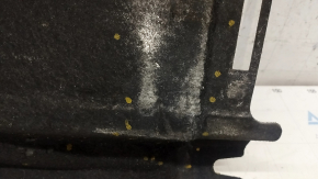 The rear left underbody protection of Audi A6 C7 12-18 is torn and worn
