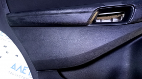 Door trim card rear left Ford Edge 15-18 black with black insert cloth, armrest black leather, scuffs, abrasions, dent