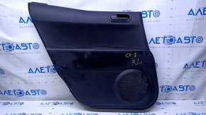 Door trim card rear left Mazda CX-7 06-09 black with black insert plastic, armrest black plastic, scratches, abrasions