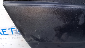 Door trim card rear left Mazda CX-7 06-09 black with black insert plastic, armrest black plastic, scratches, abrasions