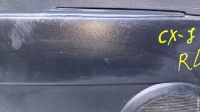 Door trim card rear left Mazda CX-7 06-09 black with black insert plastic, armrest black plastic, scratches, abrasions
