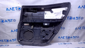 Door trim card rear left Mazda CX-7 06-09 black with black insert plastic, armrest black plastic, scratches, abrasions