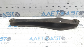 The lower rear left control arm of a Jeep Compass 11-16 is rusty and the silent blocks are torn.