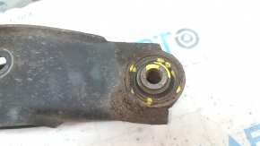 The lower rear left control arm of a Jeep Compass 11-16 is rusty and the silent blocks are torn.