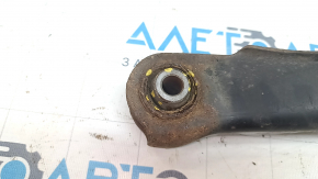The lower rear left control arm of a Jeep Compass 11-16 is rusty and the silent blocks are torn.