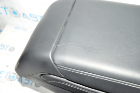 Tesla Model Y 20 center console armrest and cup holders - black leather, type 1, no wiring, minor tear, scratch