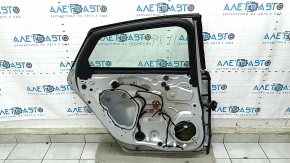 Door assembly rear left Ford Fusion mk5 13-20 silver UX, dent, bumps, cracks in the trim