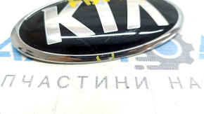 Emblem badge KIA front bumper Kia Niro 17-21 sand, varnish swelled