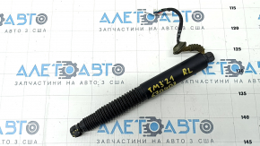 Left trunk lid shock absorber Tesla Model 3 18- electric, corner broken, boot torn