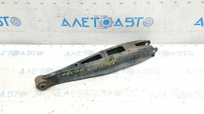 The lower rear left control arm of a Subaru Impreza WRX GH 08-14 is rusty.