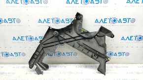 The rear left underbody protection of the BMW 5 G30 18- 530e hybrid is torn, rubbed, pressed