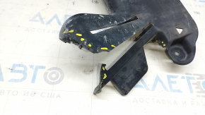 The rear left underbody protection of the BMW 5 G30 18- 530e hybrid is torn, rubbed, pressed