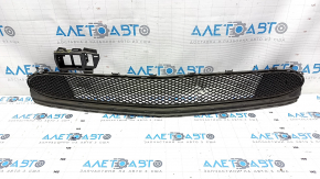The lower grille of the front bumper of the Mercedes CLA 17-19 is dented, cracks