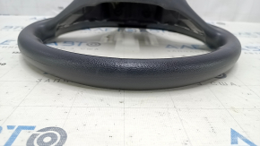 Naked steering wheel for a VW Jetta 19-23, black rubber, no buttons or trim.