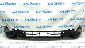 The front bumper lip of a Ford Escape MK4 20-22 for parking sensors is dented.