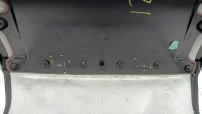 Tesla Model Y 20-25 rear passenger seat trim panel is black, with broken fasteners and scratches.
