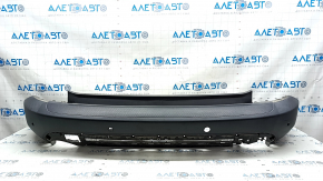 Bare rear bumper for Ford Escape MK4 20-24 with parking sensors and no towbar. Structure, scratches, and detached parking sensor ring.