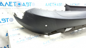 Bare rear bumper for Ford Escape MK4 20-24 with parking sensors and no towbar. Structure, scratches, and detached parking sensor ring.