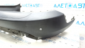 Bare rear bumper for Ford Escape MK4 20-24 with parking sensors and no towbar. Structure, scratches, and detached parking sensor ring.