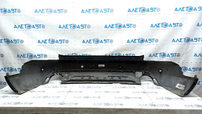 Bare rear bumper for Ford Escape MK4 20-24 with parking sensors and no towbar. Structure, scratches, and detached parking sensor ring.