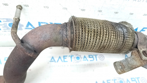 Jeep Renegade 15-15 2.4 exhaust pipe has a torn mesh and is rusty.