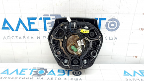 The airbag in the driver's steering wheel of a BMW 3 G20 19-24 is black and the mount is broken.
