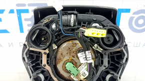 The airbag in the driver's steering wheel of a BMW 3 G20 19-24 is black and the mount is broken.