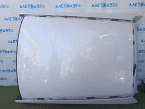 The metal roof of a Mazda CX-30 20-23, without a sunroof and antenna, is sawn off and dented.