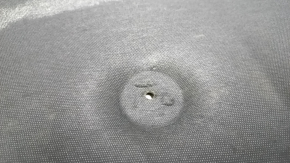 Jeep Cherokee KL 19-23 hood insulation is torn and dented.