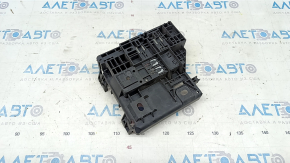 The underhood fuse box housing of a Ford Escape MK4 20-25 has a broken mount.