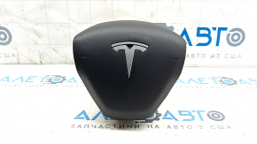 Steering wheel airbag for the driver's side of a Tesla Model 3 18-inch black, rusty, worn.
