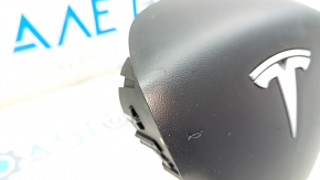 Steering wheel airbag for the driver's side of a Tesla Model 3 18-inch black, rusty, worn.