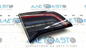 Tesla Model 3 18-Type 2 inner trunk lid light, left, scratches