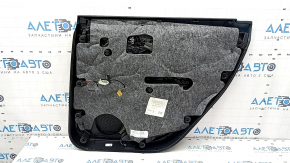 The door panel, rear left, Audi Q7 16-19, is black, the bottom is black leather, the armrest is brown leather, the insert is black Alcantara, Bose, under the curtain with a handle and overlay is black