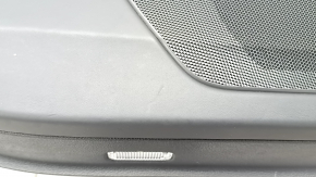 The door panel, rear left, Audi Q7 16-19, is black, the bottom is black leather, the armrest is brown leather, the insert is black Alcantara, Bose, under the curtain with a handle and overlay is black