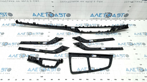 A set of interior trims for the Audi Q7 16-19 in dark wood, type 2, scratches, faded center console trim