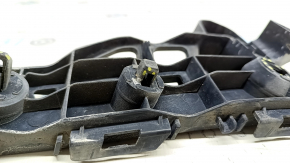 The right front bumper mount on a Toyota Prius V 12-17 has broken latches.