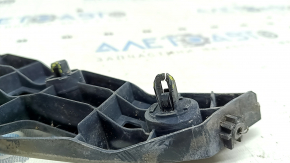 The right front bumper mount on a Toyota Prius V 12-17 has broken latches.