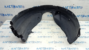 The front left fender liner of a Lexus ES300h ES350 13-18 has a torn fastener.