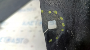 The front left fender liner of a Lexus ES300h ES350 13-18 has a torn fastener.