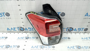Left headlight for a 1997 Subaru Forester with wiring.