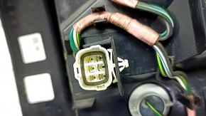 Left headlight for a 1997 Subaru Forester with wiring.