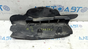 The lower control arm cover under the rear right spring of the Audi Q5 80A 18-24 is dented, worn, and has tears.