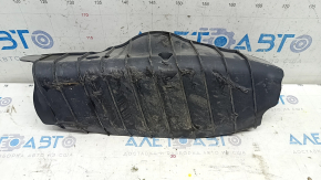 The lower control arm cover under the rear right spring of the Audi Q5 80A 18-24 is dented, worn, and has tears.