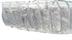 The lower control arm cover under the rear right spring of the Audi Q5 80A 18-24 is dented, worn, and has tears.
