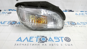 Right turn signal for a 1992 Toyota Prius V, sand and scratches.