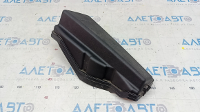 The underhood fuse box cover, left, for a Lexus ES300h 13-15, has a broken mount.