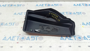 The underhood fuse box cover, left, for a Lexus ES300h 13-15, has a broken mount.